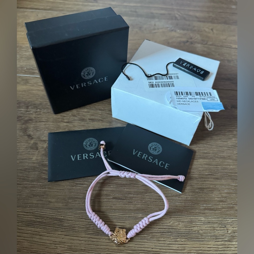 VERSACE-AUTHENTIC NWT Medusa Gold Charm, Pink Braided Adjustable Bracelet